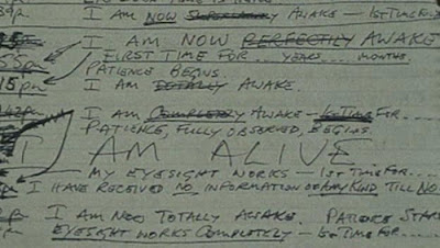Handwritten manuscript fragment repeating I am now awake and I am alive